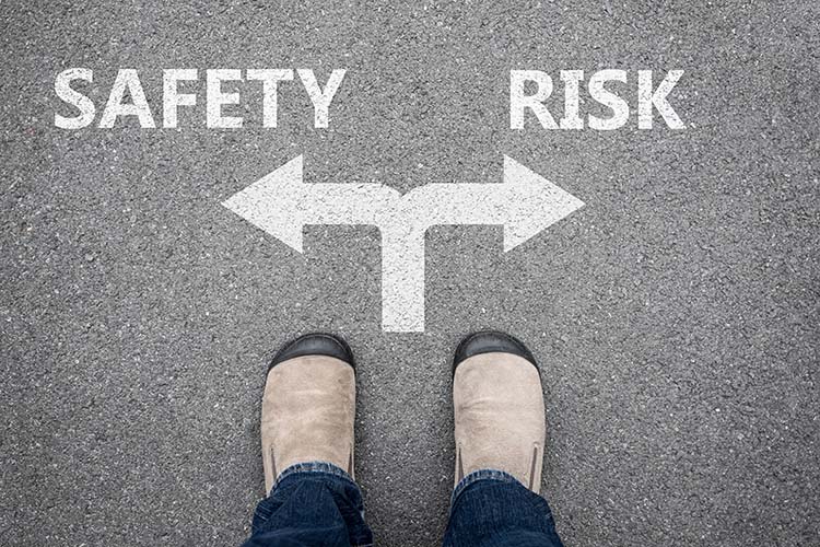 Arrows facing opposite directions with the words Safety and Risk