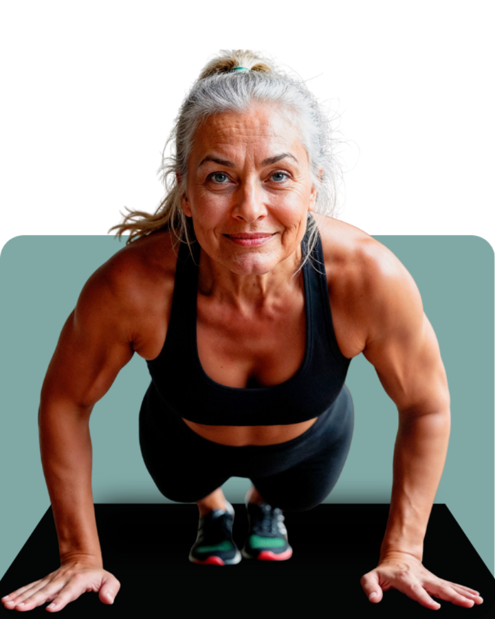 Woman smiling and doing a plank exercise