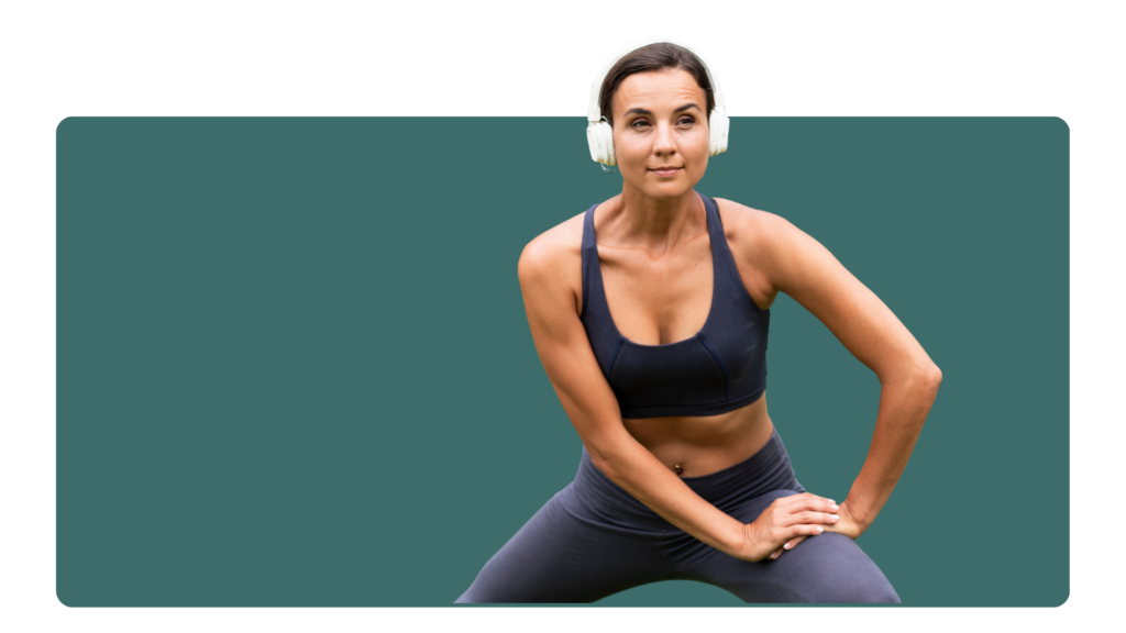 Woman wearing headphones and stretching before exercise