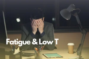 Man with his head in his hands and the test "Fatigue and Low T."